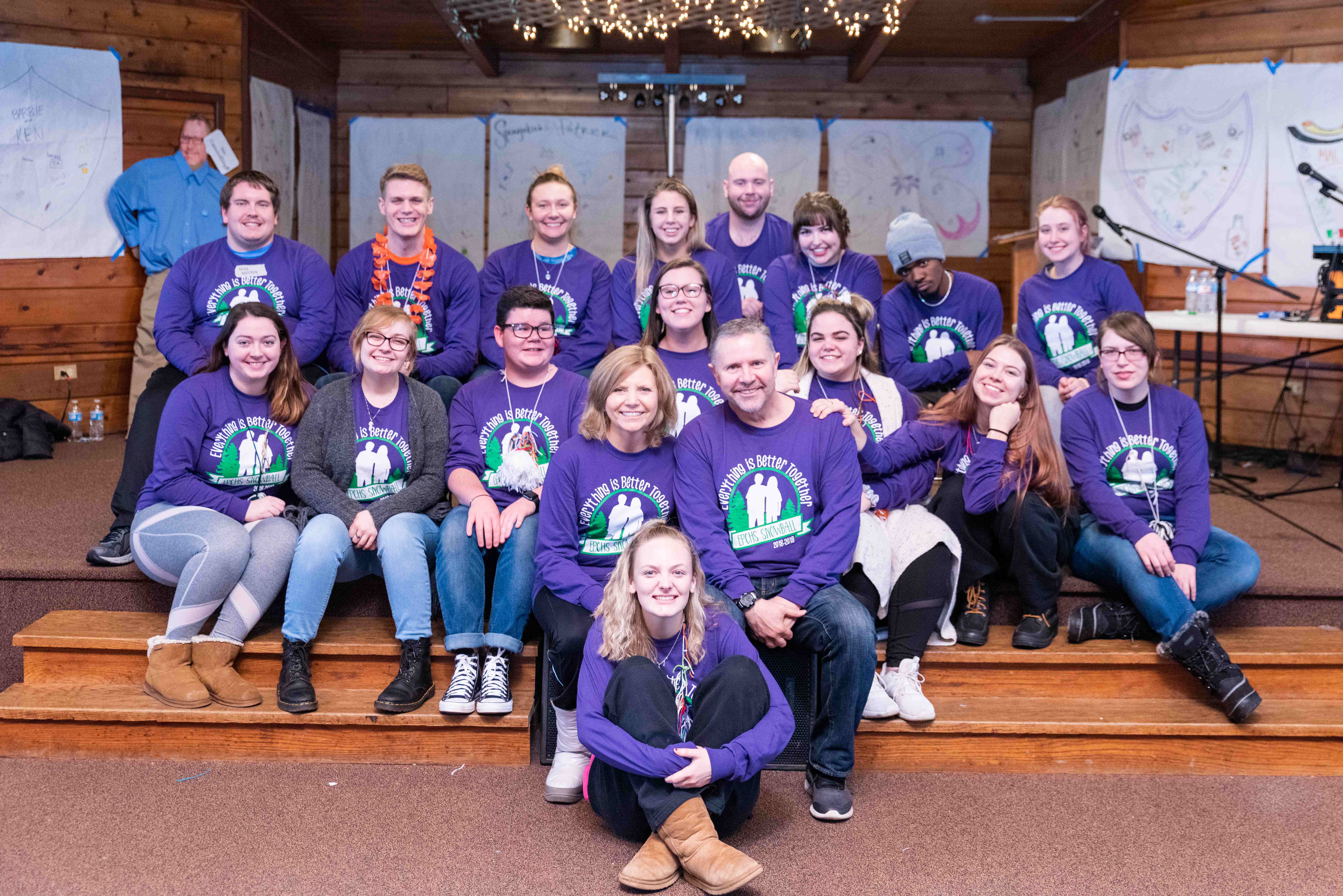 Ray Schellenberger with a group of Evergreen Park students in matching purple Operation Snowball sweatshirts at a retreat